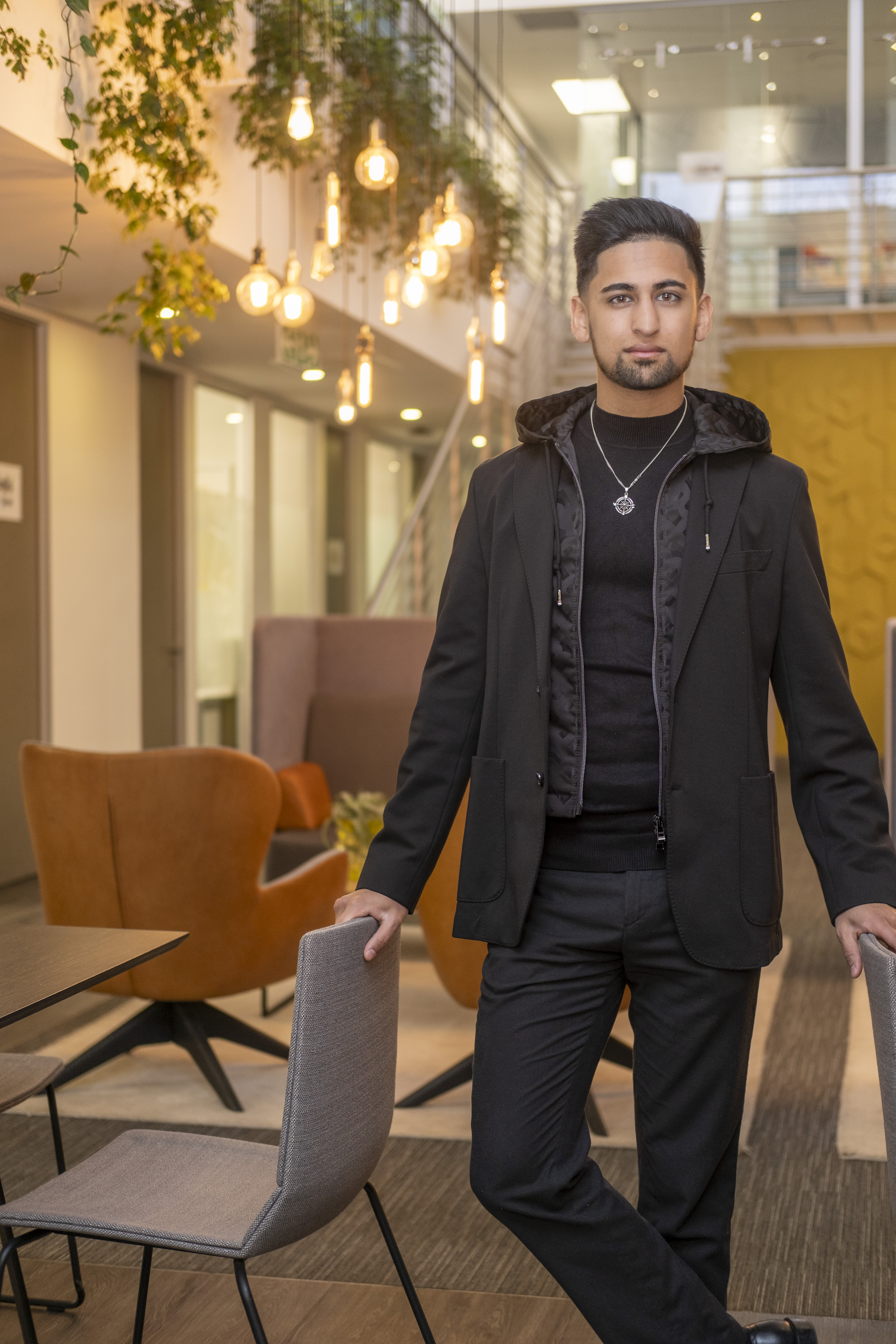Abdullah Hassan - Professional portrait in business attire with confident smile
