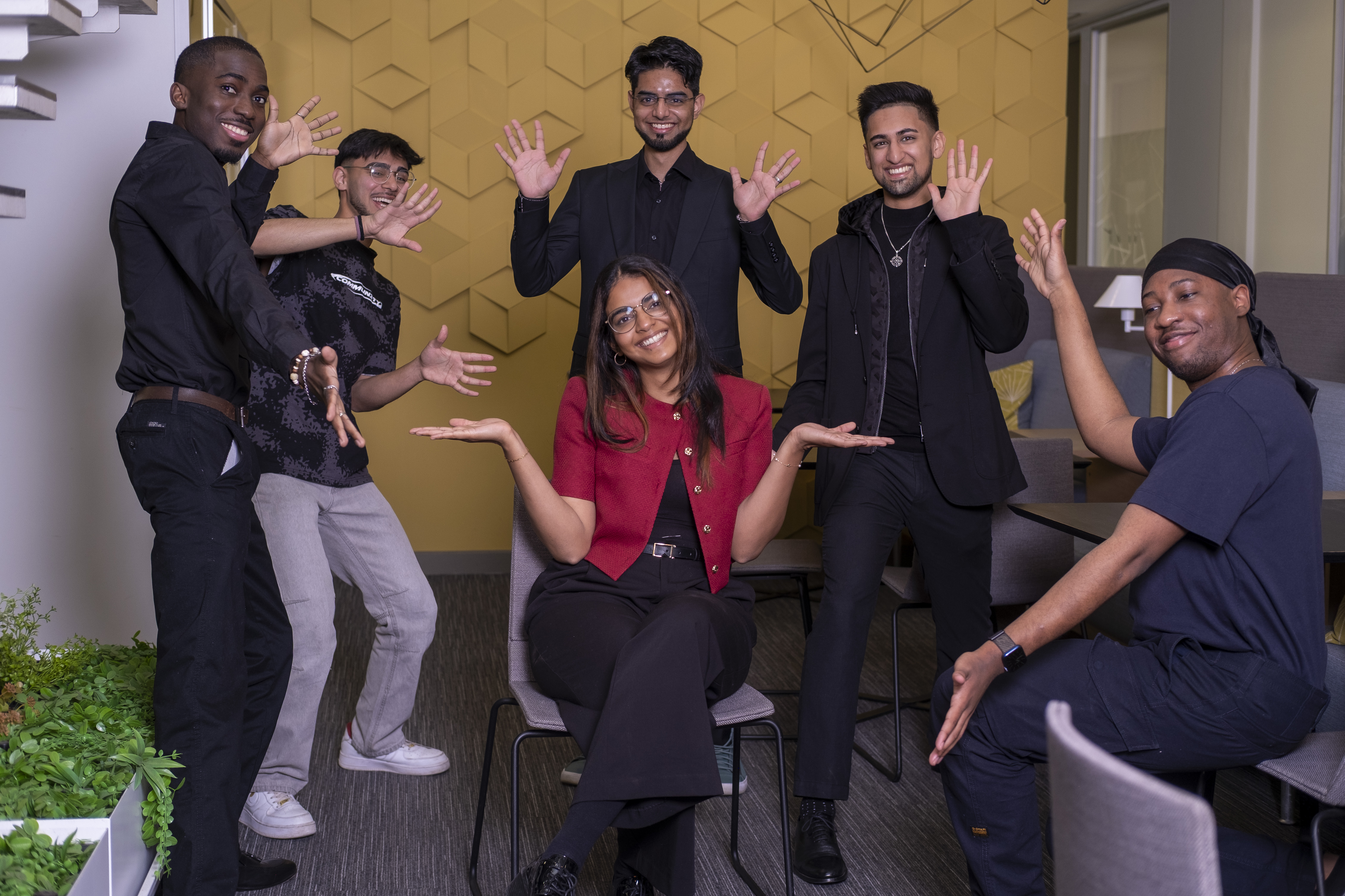 Group photo in modern workspace with diverse team